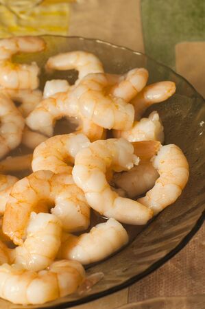 Boiled royal shrimps in a plate before the useの写真素材