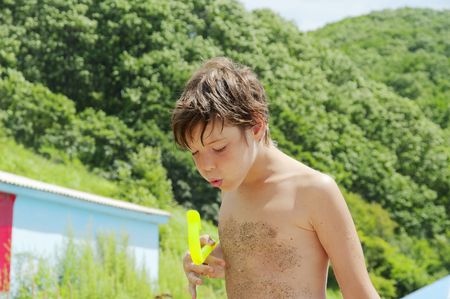 The boy blows in a tube for swimming under waterの写真素材
