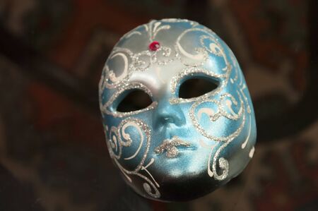 The Venetian mask on a transparent tableの写真素材