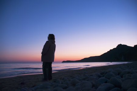 The elderly woman looking in a distance on a declineの写真素材