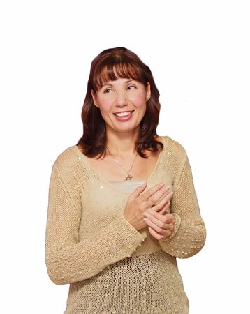 The smiling woman in a knitted jacket on a white background の写真素材