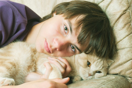 Portrait of young man with long hair with katの写真素材