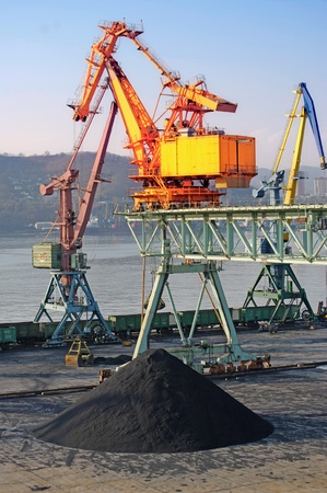 The cargo crane in sea port for loading of bulk cargoes. A city nakhodka russiaの写真素材