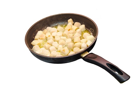 Preparing saute of scallops (with butter) in a frying panの写真素材