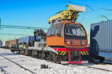 Train crane carriage  Hydraulic crane mounted on a railroad car  freight train  for lifting the...