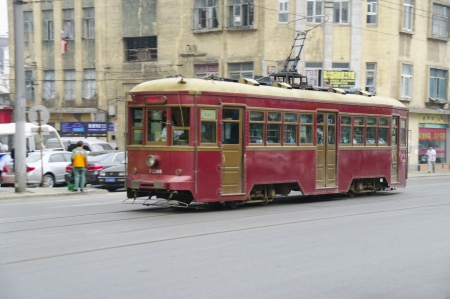 Dalian China - SEPT 2010 : ancient city tram on a streetのeditorial素材