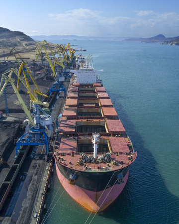 Vessel under loading in vostochny port, Russiaの写真素材