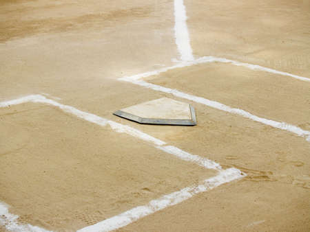 Home plate and chalk lines on a baseball diamondの写真素材