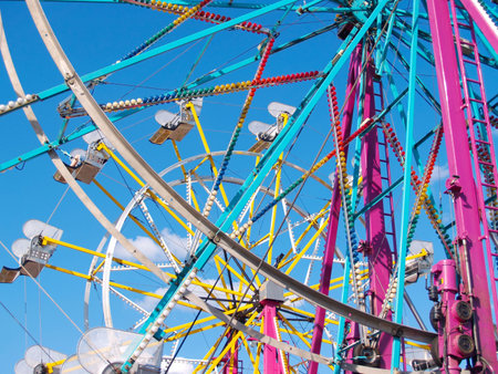 Close view of a ferris wheel with a second wheel in background      の写真素材