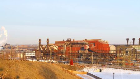 Old, but still working, steel mill in an industrial valleyの写真素材