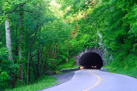 Headlights emerging from a highway tunnel in Great Smoky Mountains National Parkの写真素材