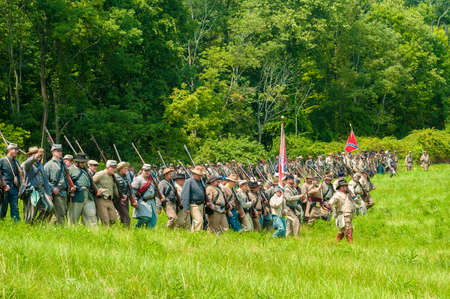 BATH, OH, USA - AUGUST 9, 2014  Confederate soldier reenactors march into battle formation at a Civil War reenactment of the 3rd Battle of Winchester  1864  at Hale Farm and Village in Ohio のeditorial素材