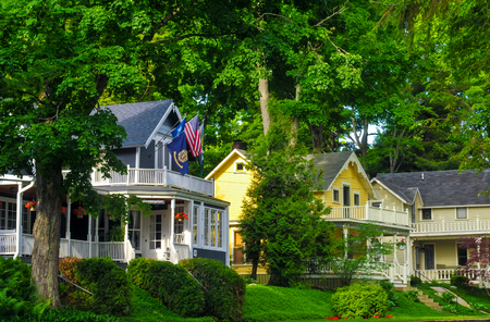 BAY VIEW, MI - JUNE 26, 2014: Quaint old homes, many of them providing tourist lodgings, line the shady streets of this one-time Methodist retreat center next to Petoskey on Lake Michigan.のeditorial素材