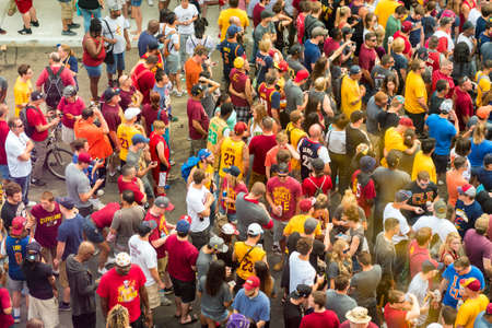 CLEVELAND, OH - JUNE 22, 2016: Cavs fans mingle in the streets wearing team colors and apparel in anticipation of the Cleveland Cavaliers' NBA championship parade.のeditorial素材