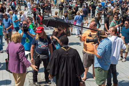 CLEVELAND, OH - JULY 20, 2016: A Trump supporter and a man in a purple jacket have a conversation on...