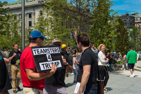 CLEVELAND, OH - JULY 20, 2016: A Trump supporter holds a sign among the crowds of people on Public Square during the Republican National Conventionのeditorial素材