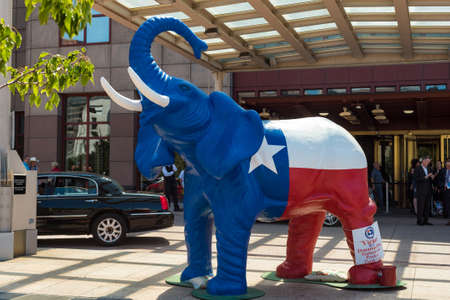 CLEVELAND, OH - JULY 20, 2016: A red-white-and-blue elephant stands in front of the downtown Marriott Hotel with a donation bucket during the Republican National Convention.のeditorial素材