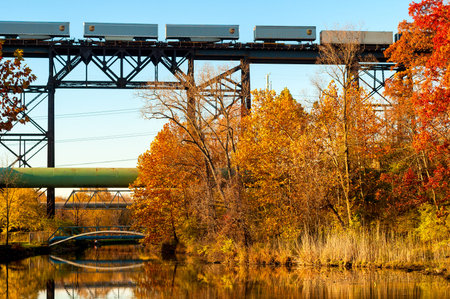 CUYAHOGA HEIGHTS, OH - NOVEMBER 2, 2015: A UPS freight train crosses a high trestle above the Ohio...