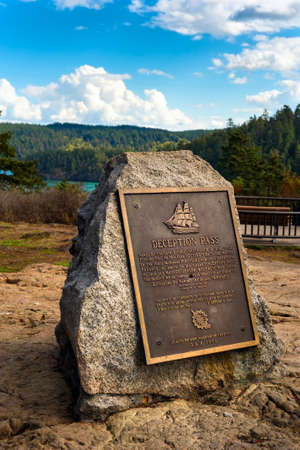 Historical marker at Deception Pass, Washington, a turbulent channel between Skagit Bay and the Pacific Oceanのeditorial素材