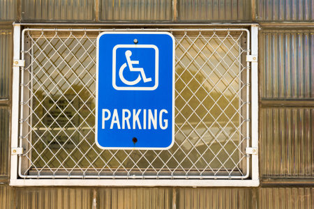 Handicapped parking sign on a window of a businessの写真素材
