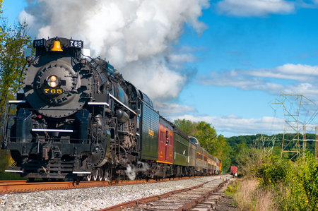 BRECKSVILLE, OH, USA - SEPTEMBER  14, 2013: The historic Nickel Plate 765 steam engine charges down...
