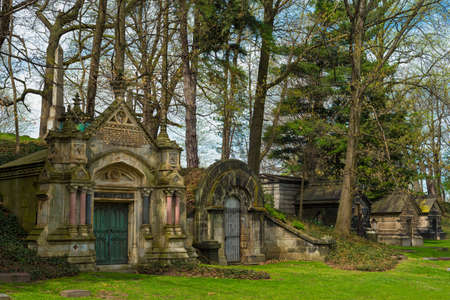A row of old weather-beaten mausoleums in a Cleveland cemeteryの写真素材