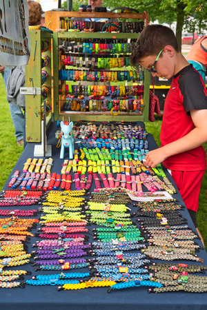 TWINSBURG, OH - JUNE 9, 2018: Colorful craftt merchandise is on display at a vendor booth at A Taste of Twinsburg, a culinary and arts and crafts festival held in summer on the town square.のeditorial素材