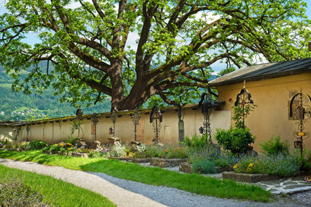 A picturesque row of old graves in the courtyard of the Nonnberg Abbey in Salzburg, Austria