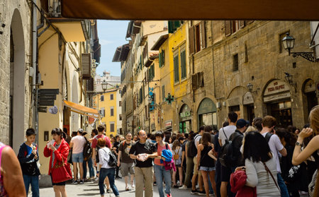 FLORENCE, ITALY - JUNE 1, 2019: A long line of lunchtime visitors queues up for panini from a...