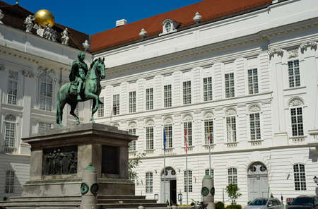 Statue of Kaiser Joseph II (1741-1790) in the Josefplatz in Vienna, Austria; the building behind the emporer houses the National Library of the Hofburg.のeditorial素材