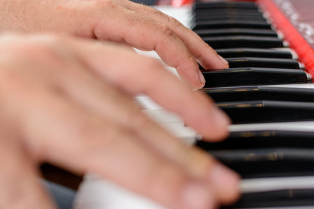 Picture of two hands playing pianoの写真素材