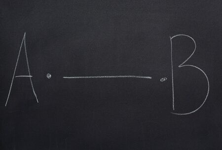 Blackboard written with a line from point A to point Bの写真素材