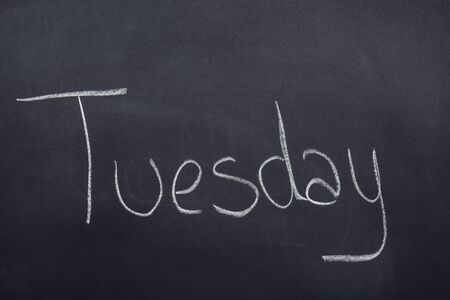 Day of the week written on a blackboard with white chalk, tuesdayの写真素材