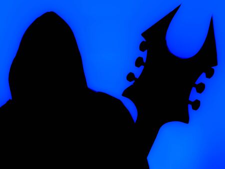 Guitarist with hood and a pointed Heavy Metal guitar with horned headstock on blue backgroundの写真素材