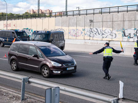 Madrid, Spain; 04/30/2020: Police control at the Madrid exit for unjustified movements of citizens during the state of alarm due to Coronavirusのeditorial素材