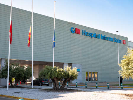 San Sebastian de los Reyes, Madrid, Spain; 05/22/2020: Flags (Community of Madrid, Spain and Europe) at half mast at the Infanta Sofía University Hospital, during the coronavirus alarm stateのeditorial素材