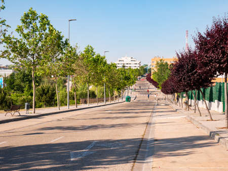 San Sebastian de los Reyes, Madrid, Spain, 05/23/2020: People walking and playing sports on a closed road for the exclusive use of pedestrian use during the coronavirus alarm stateのeditorial素材