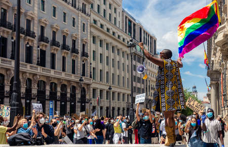 Madrid, Spain; 07/06/2020: Black woman waving an LGBT flag during the black lives matter protests in Madridのeditorial素材
