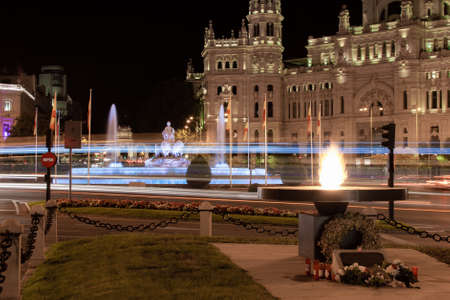 Madrid, Spain; 06/08/2020: Monument in tribute to the victims of Covid-19 consisting of an eternal flame in front of the Plaza de Cibeles and the city hall in Madrid, Spainのeditorial素材