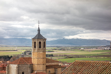 Avila, Spain; 11-28-2020: View from the Avila wall of the church of Santiago and the adjacent...