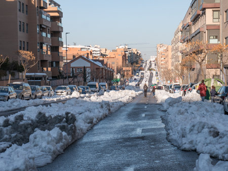 San Sebastian de los Reyes, Madrid, Spain; 01-13-2021: Roads opened through the snow for the transit of vehicles after the passage of the storm Filomena in the streets of the cityのeditorial素材