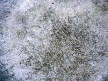 Abstract background created by frozen water inside a bucket due to low winter temperatures outside