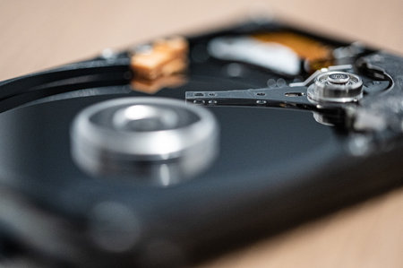 Close up photo of the read and write head of a hard drive while it is workingの写真素材
