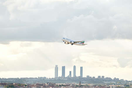 Madrid, Spain; 09-25-2021: Airbus A319 of the airline Bulgaria Air taking off from Madrid airport leaving behind a panorama of its famous office towersのeditorial素材