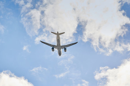 Madrid, Spain; 09-25-2021: Airbus A320 plane of Lufthansa airline viewed from a low angle and from behind just after take off in a blue skyのeditorial素材