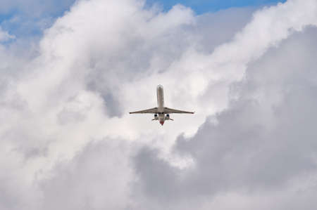 Madrid, Spain; 09-25-2021: Mitsubishi CRJ-1000 model plane, of the Iberia Regional airline in full takeoff with some beautiful clouds behindのeditorial素材