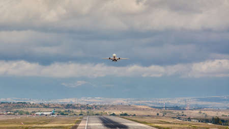 Madrid, Spain; 09-25-2021: Runway with rubber marks from aircraft landings, while an Airbus A319 aircraft of Alitalia Airline takes offのeditorial素材