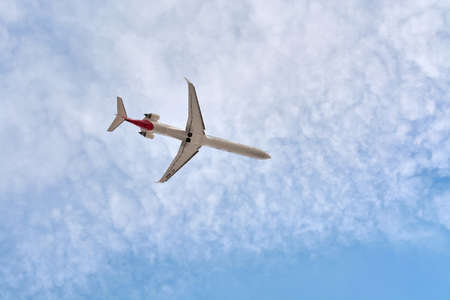 Madrid, Spain; 09-25-2021: Mitsubishi CRJ-1000 model airplane, from Iberia Regional airline, seen with a low angle view shortly after taking off with a nice cloudy sky behindのeditorial素材
