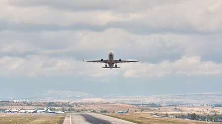 Madrid, Spain; 09-25-2021: Runway with rubber marks from aircraft landings, while an Airbus A330 aircraft of the Turkish Airlines takes offのeditorial素材