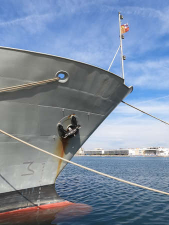 Valencia, Spain; 10-03-2021: Bow of the ship Alboran patrol ship with the anchor collected and lines joining the marking to the port and scale of the bow representing the draft of the shipのeditorial素材